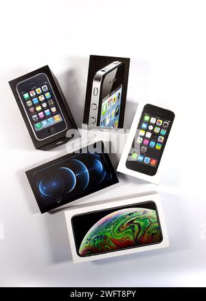group of  vintage old apple iphone boxes packaging, iphone 3gs, iphone 4 white studio background Stock Photo