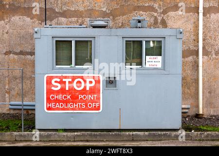 grey steel military security checkpoint building & stop sign MOD hack green secret bunker cheshire, command post now a muse Stock Photo
