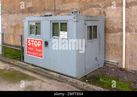 grey steel military security checkpoint building & stop sign MOD hack green secret bunker cheshire, command post now a muse Stock Photo