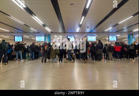 Arriving passengers at arrivals queue to use E gates passport control to enter the UK. Border. North Terminal, London Gatwick Airport / LGW. (137) Stock Photo