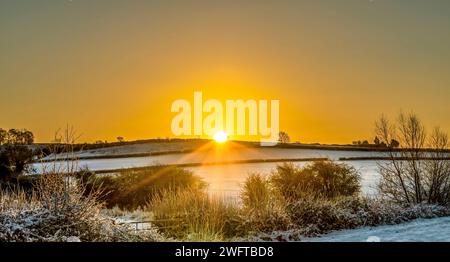 Sunrise Over A Farmers Fields Stock Photo