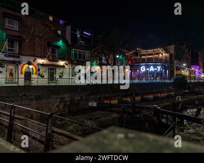 Manchester Gay Village, a view of Canal Street including the canal, late night club G-A-Y and the New Union Hotel, night shot, Manchester, England Stock Photo