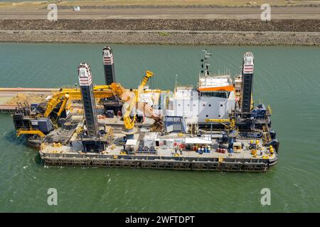 Panama Canal, Panama - 23 January 2024: Large industrial barge used to dredge the canal to remove silt and dirt. Stock Photo