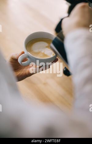 Close-up, barista preparing latte. Stock Photo