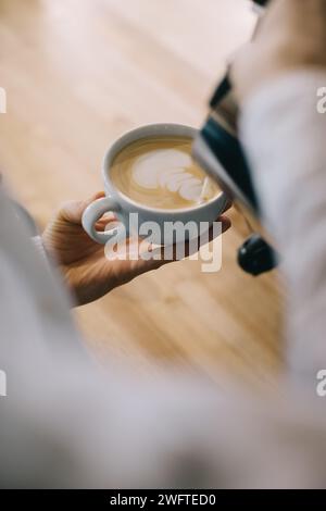Close-up, barista preparing latte. Stock Photo