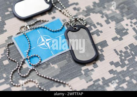 Army tokens on military uniform background Stock Photo