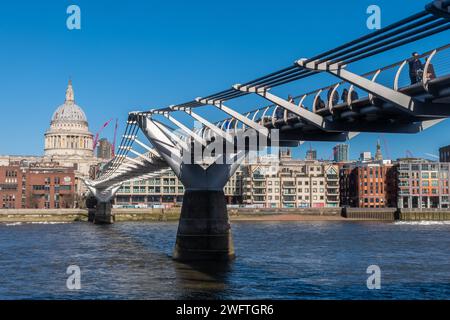 View of the Millennium Bridge across the River Thames with St Paul's Cathedral in London, England, UK, a footbridge also known as the wobbly bridge Stock Photo