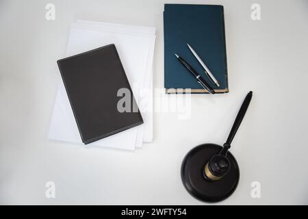 Top view of Wooden gavel and books on table in lawyer's office. Stock Photo