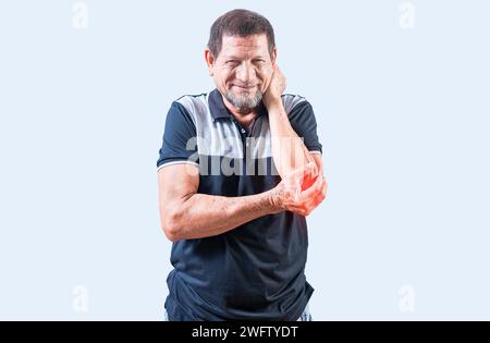 Mature man with elbow pain isolated. Elderly man suffering from elbow pain. Concept of Elbow Arthritis Stock Photo