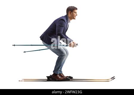 Full length profile shot of a businessman skiing isolated on a white background Stock Photo
