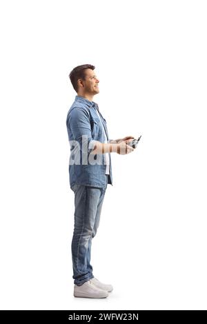 Man holding a drone cotroller device isolated on white background Stock Photo