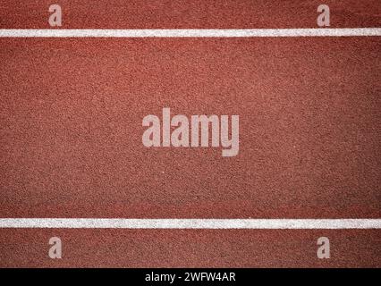 Running track rubber cover texture top view with two white lines background Stock Photo
