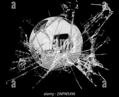 Fast soccer ball through broken glass on black background Stock Photo