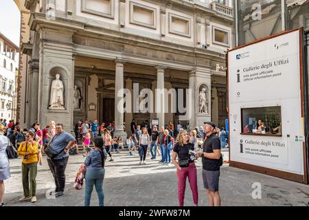 People standing near a visitor help kiosk at The Uffizi Gallery in Florence, Italy Stock Photo