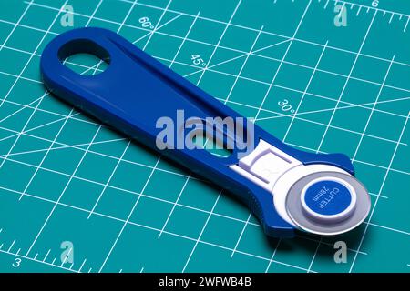 Fabric Rotary Cutter Cut Out on White. Stock Photo
