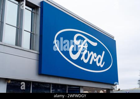 Wolverhampton, England – January 31 2024: Large front signage of a Ford car Dealership Stock Photo