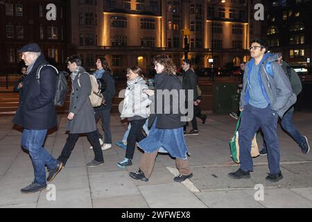 London, UK. 8 Feb 2024. People Protect Themselves From The Rain Wrapped ...