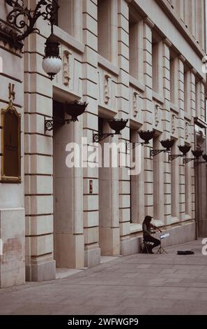 woman playing the piano in a central street in Madrid in Spain on September 14, 2021 Stock Photo