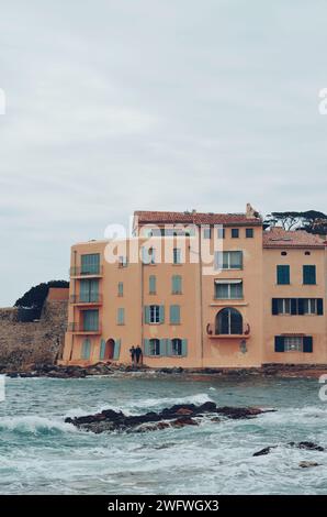 Orange houses by the sea of Saint Tropez in France on April 20, 2019 Stock Photo