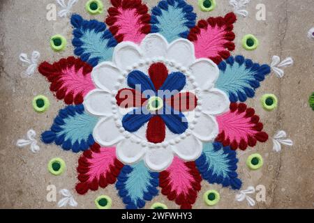 Beautiful white Flower design rangoli. Rangoli making patterns. Rangoli designs inside house Stock Photo