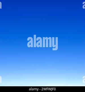 empty blue sky fading from white on the horizon to dark blue Stock Photo