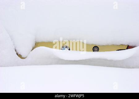a BMW completely covered in snow Stock Photo