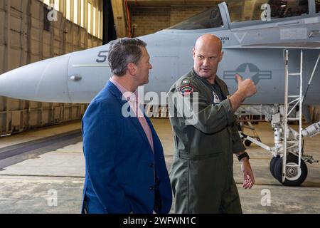 Pensacola, Fla. -- Training Air Wing Six Commodore Capt. Doug White speaks with Rep. Ronny Jackson (R-Texas) at Naval Air Station Pensacola, Florida, Jan. 24. Jackson, a retired Navy Medical Corps officer, toured the air station as part of a familiarization tour of military installations in Florida, (Official U.S. Navy Stock Photo