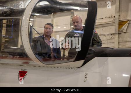 PENSACOLA, Fla. -- Training Air Wing Six Commodore Capt. Doug White speaks with Rep. Ronny Jackson (R-Texas) over a U.S. Navy training aircraft at Naval Air Station Pensacola, Florida, Jan. 24, 2024. Jackson, a retired Navy Medical Corps officer, toured the air station as part of a familiarization tour of military installations in Florida. (Official U.S. Navy Stock Photo