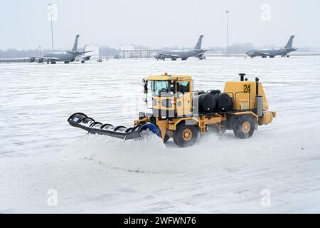 Cold weather and snow arrives at Selfridge Air National Guard Base, Michigan, where snow removal operations take place around KC-135T Stratotanker air refueling aircraft in preparation for training Jan. 16, 2024. Stock Photo