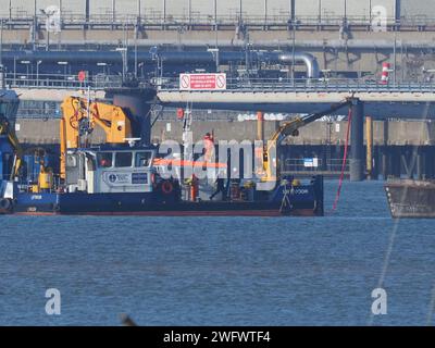 Queenborough, Kent, UK. 1st Feb, 2024. Three vessels seen in the Medway attempting to recover a sunken crane barge on behalf of Peel Ports London Medway, pictured from Queenborough, Kent. Credit: James Bell/Alamy Live News Stock Photo