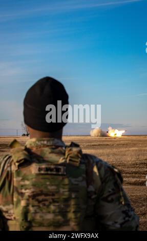 U.S. Army Sgt. Christopher Drummond, Fire Control Specialist from Headquarters and Headquarters Battalion, 82nd Airborne Division, “Task Force 82,” oversees the firing of an M142 High Mobility Artillery Rocket System (HIMARS) at Smardan Training Area, located in Galati County, Western Moldavia, Romania, Jan. 17, 2024. The Reduced Range Practice Rockets were fired by the Romanian 8th Field Artillery Brigade, and supported by U.S. Army 4th Battalion, 4th Security Forces Assistance Brigade, attached to “Task Force 82.” The artillery exercise afforded the artillery crew members the opportunity to Stock Photo