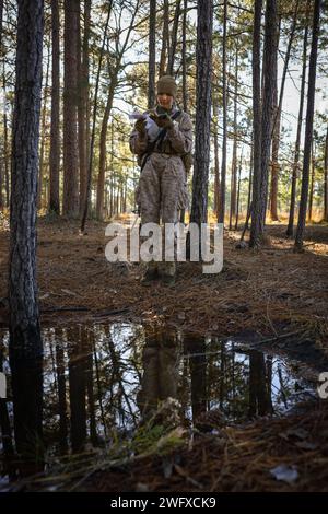 Recruits with India Company, 3rd Recruit Training Battalion, conduct the land navigation course on Marine Corps Recruit Depot Parris Island, S.C., Jan. 17, 2024. Land navigation is part of Basic Warrior Training and is designed to teach recruits how to use a lensatic compass and topographic map. Stock Photo