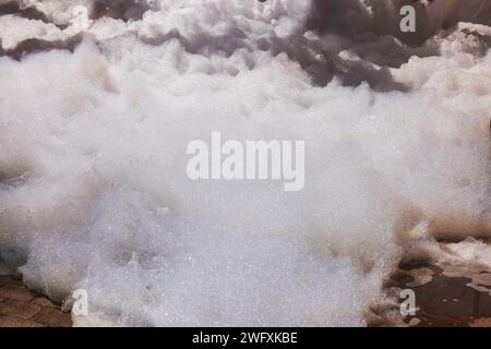 Close-up view of large pile of foam during outdoor foam party. Stock Photo