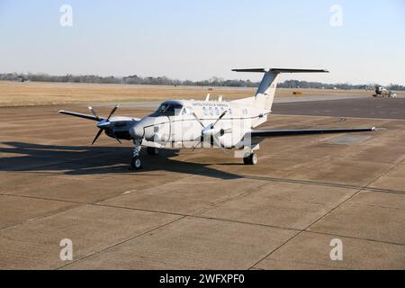 A C-12 Huron airplane assigned to Detachment 1, Company B, 1st Battalion, 228th Aviation Regiment, U.S. Army Reserve, Fort Novosel, Alabama, is parked at Cairns Army Airfield Jan. 31, 2024. Stock Photo