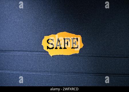 Foam alphabet letter in word safe on wood background. Stock Photo