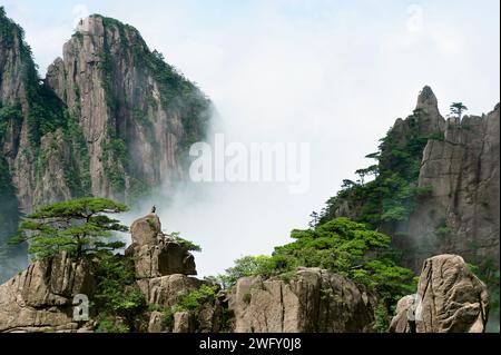 Clouds float amidst the Second Ring Road in Western Grand Canyon of Huangshan Yellow Mountains. Stock Photo
