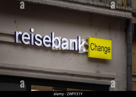 Picture of a sign with the logo of Reisebank on their main office for Dusseldorf, Germany. ReiseBank AG is a bank specializing in foreign currency dea Stock Photo