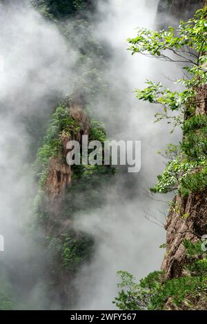 Clouds float amidst the Second Ring Road in West Sea (Xihai) Grand Canyon of Huangshan Yellow Mountains. Stock Photo