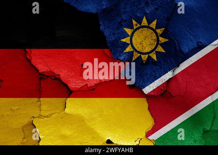 flags of Germany and Namibia painted on cracked wall Stock Photo