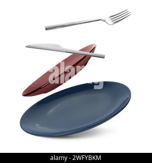 Clean plates, fork and knife falling on white background Stock Photo