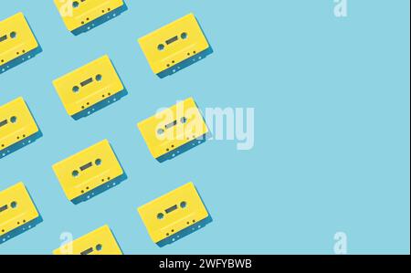 Pattern made with retro yellow audio cassette tapes on light blue background. Creative concept of retro technology. 80's aesthetic. Vintage audio Stock Photo