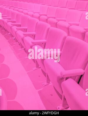 Rows of pink theater seats Stock Photo