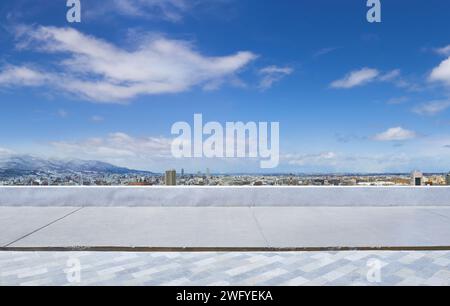 Empty cement and brick floor with beautiful Sapporo cityscape background Stock Photo
