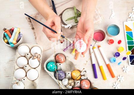 DIY Easter egg painting. Holidays and creativity. Tradition concept. Stock Photo