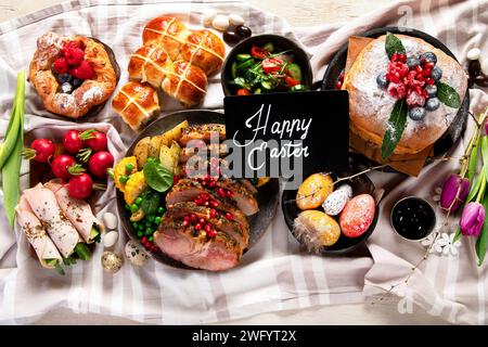 Cheerful Easter table. Traditional food at the event. Holiday concept. Top view Stock Photo