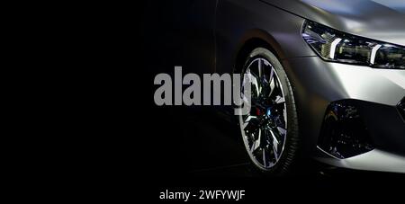 Front view of LED headlights sport car on black background, copy space Stock Photo