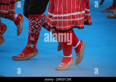 The Serbian folk dancers performing at an outdoor festival Stock Photo