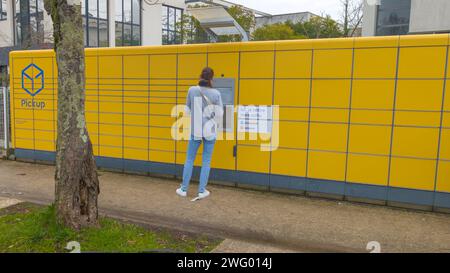 Bordeaux , France -  01 29 2024 : la poste pickup city terminal Locker Delivery Store self service with behind woman back delivery location packages Stock Photo