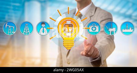 Unrecognizable HR manager using smartwatch to monitor the heart rate of an oil and gas engineer. Wearable technology concept for physical tracking, he Stock Photo