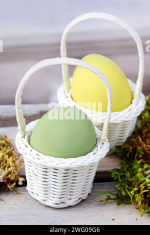 Eggs in wicker baskets, easter decoration Stock Photo